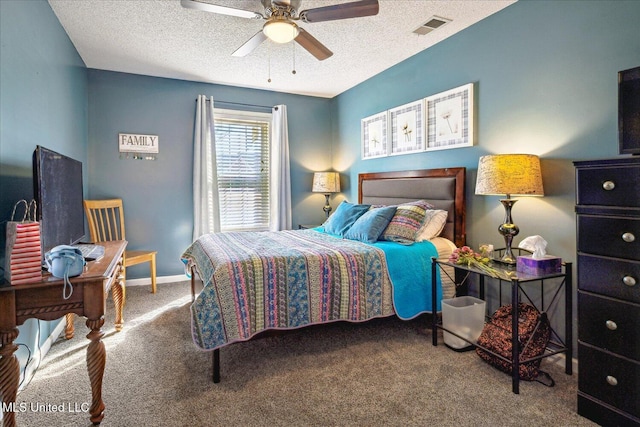 bedroom with visible vents, a ceiling fan, carpet flooring, a textured ceiling, and baseboards