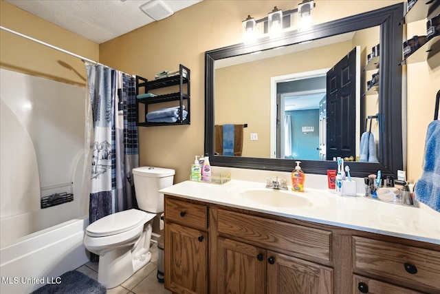 bathroom featuring shower / tub combo with curtain, visible vents, toilet, vanity, and tile patterned floors