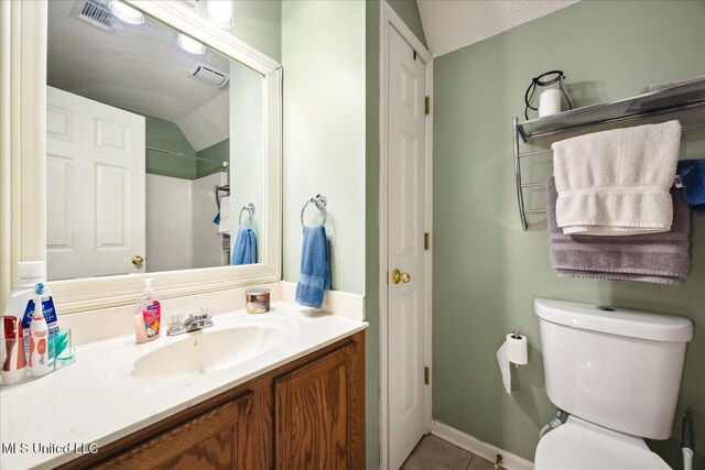 full bath with visible vents, toilet, tile patterned floors, walk in shower, and vanity