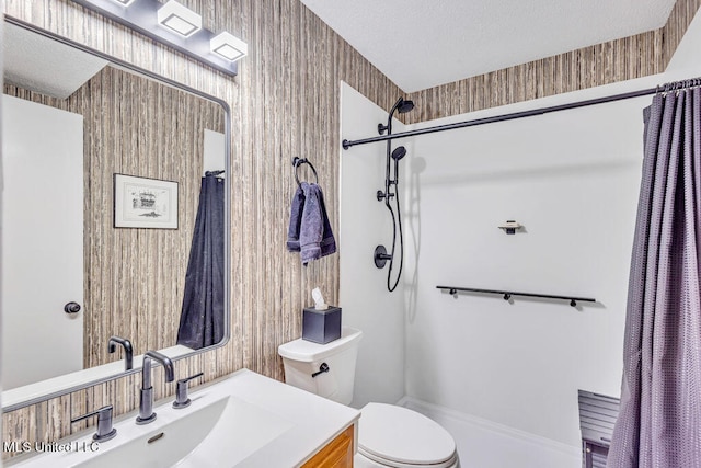 bathroom with vanity, a textured ceiling, a shower with curtain, and toilet