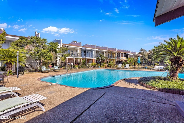 view of swimming pool featuring a patio area