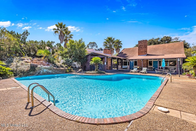 view of pool featuring a patio