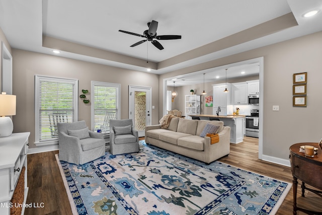 67 E Andover, Hattiesburg, MS 39402 - living area with a tray ceiling, a ceiling fan, dark wood finished floors, and recessed lighting