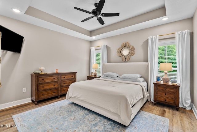 67 E Andover, Hattiesburg, MS 39402 - bedroom featuring wood finished floors, multiple windows, a raised ceiling, recessed lighting, and a ceiling fan