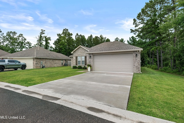 67 E Andover, Hattiesburg, MS 39402 - view of front of house featuring brick siding, a front lawn, a garage, and a shingled roof