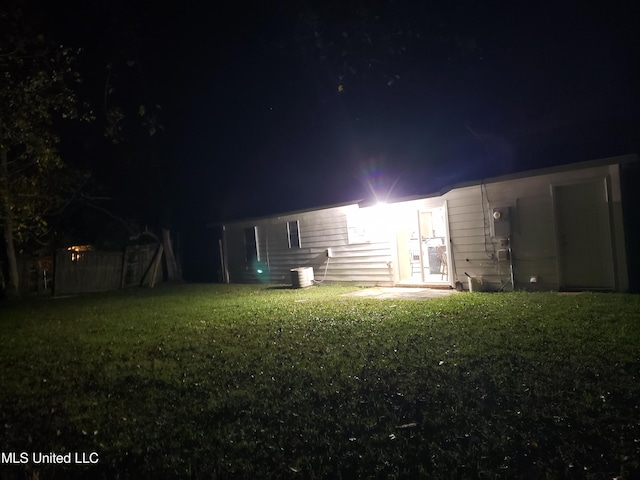 yard at twilight with cooling unit