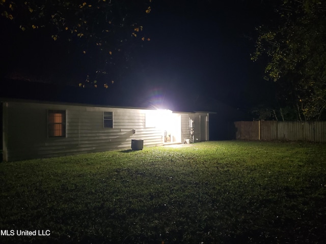 view of yard at night