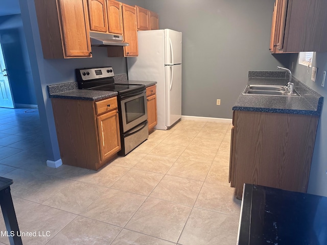 kitchen featuring white refrigerator, light tile patterned flooring, electric stove, and sink