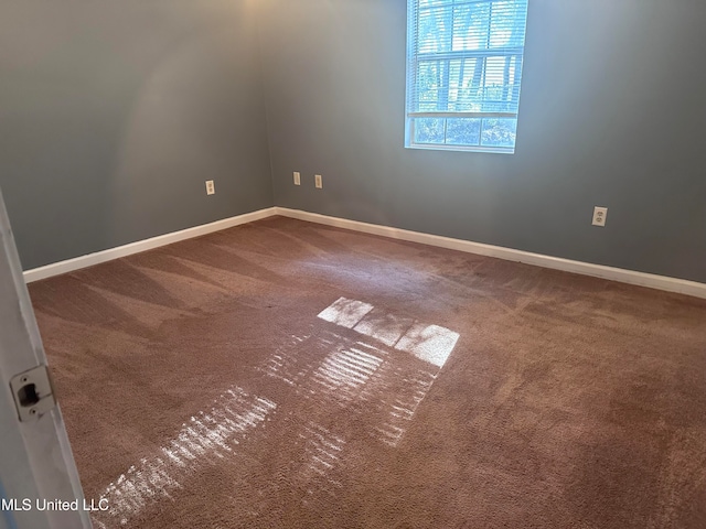 unfurnished room featuring carpet flooring