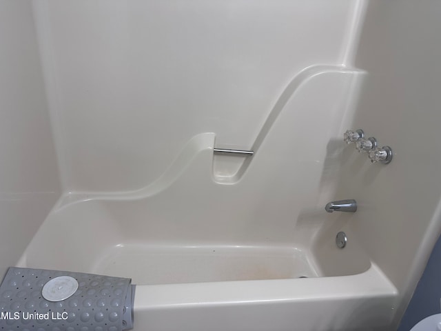 bathroom with a tub