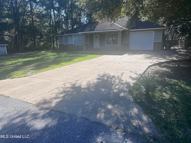 view of front of property with a garage and a front lawn