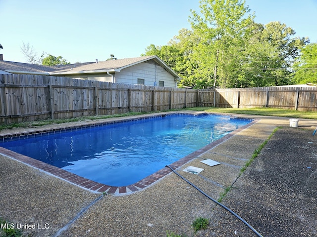 view of swimming pool with a fenced in pool and a fenced backyard