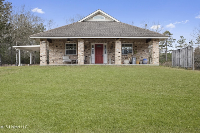 view of front of property with an attached carport, a shingled roof, a front lawn, and a porch