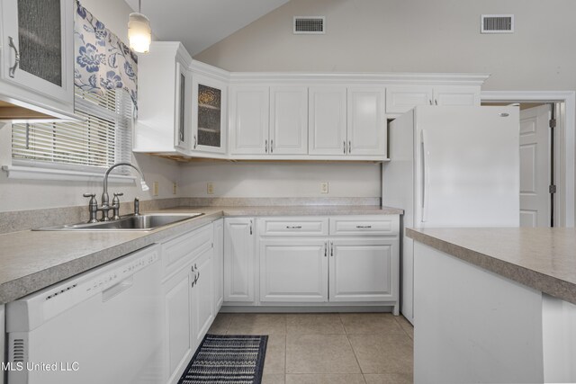 kitchen featuring white appliances, visible vents, a sink, and white cabinetry