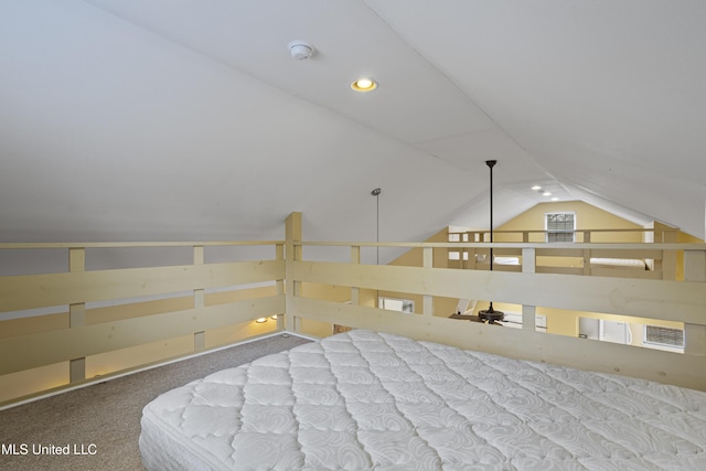 interior space featuring vaulted ceiling, recessed lighting, and carpet