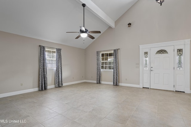 interior space featuring baseboards, light tile patterned floors, ceiling fan, and beamed ceiling