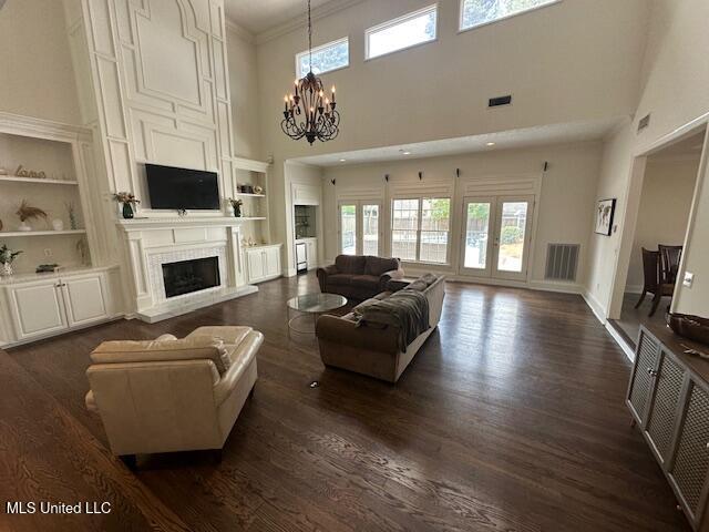 117 Peninsula Dr, Brandon, MS 39047 - living room with dark wood-style floors and built in shelves