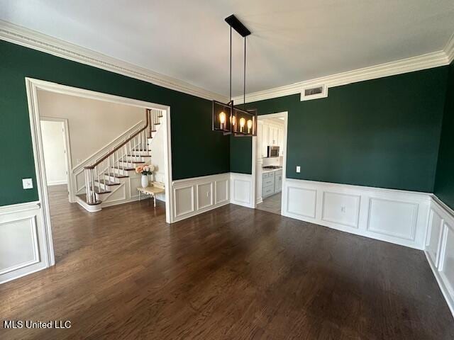 117 Peninsula Dr, Brandon, MS 39047 - unfurnished dining area featuring a wainscoted wall, visible vents, ornamental molding, stairway, and dark wood-style floors