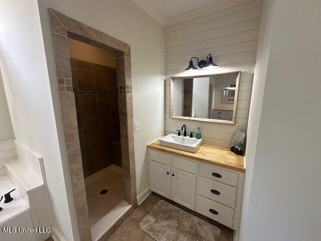 117 Peninsula Dr, Brandon, MS 39047 - full bathroom featuring vanity, crown molding, tiled shower, and a bath