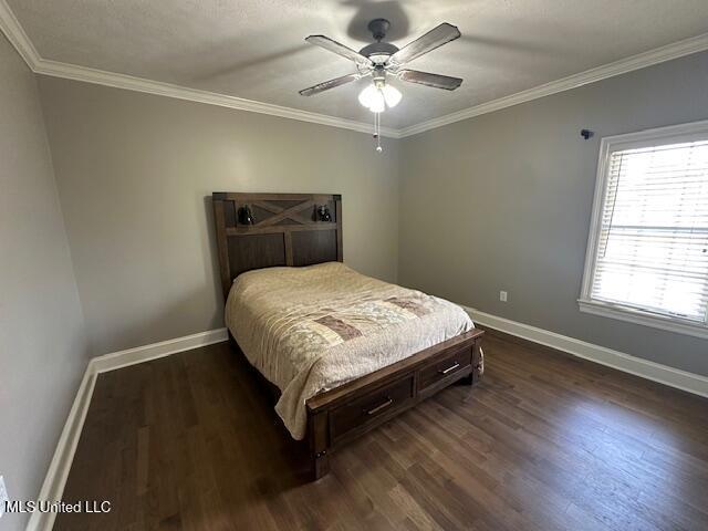 117 Peninsula Dr, Brandon, MS 39047 - bedroom featuring baseboards, crown molding, and dark wood finished floors