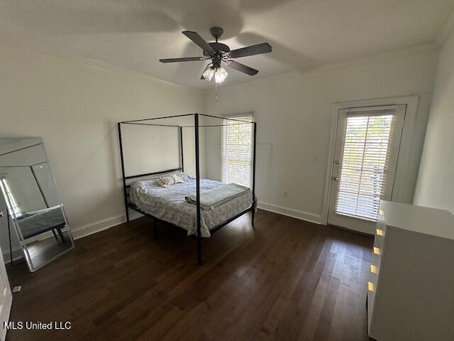 117 Peninsula Dr, Brandon, MS 39047 - unfurnished bedroom featuring baseboards, wood finished floors, and a ceiling fan
