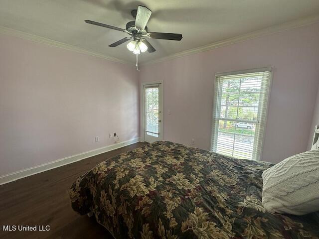 117 Peninsula Dr, Brandon, MS 39047 - bedroom featuring dark wood-type flooring, a ceiling fan, baseboards, and crown molding