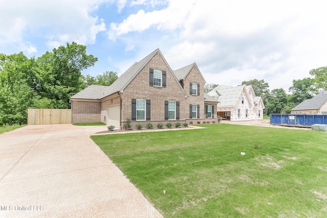 view of front of house with brick siding, driveway, and a garage