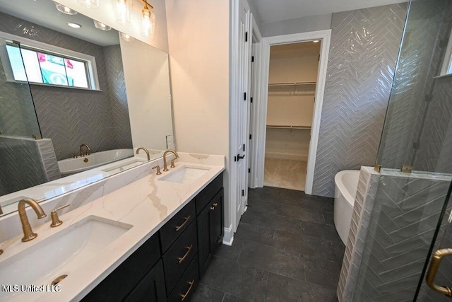 bathroom featuring shower with separate bathtub and vanity