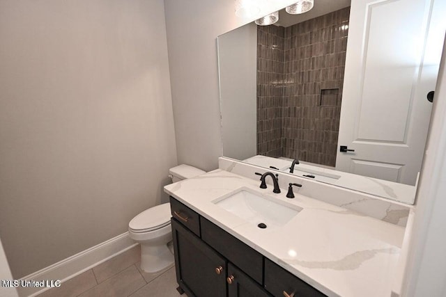 bathroom with tile patterned floors, vanity, toilet, and a shower