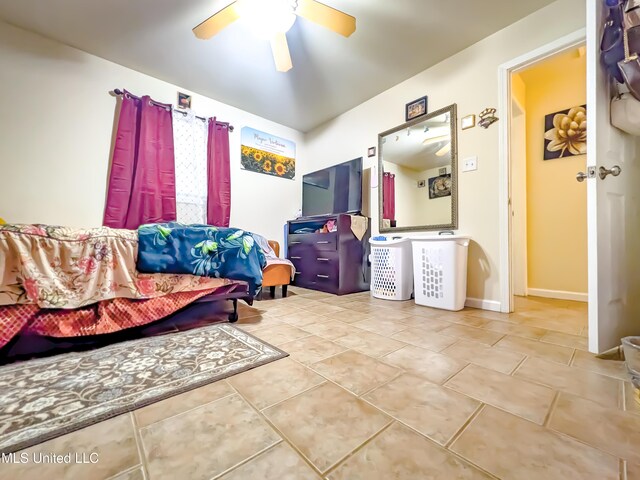2220 18th Ave, Gulfport, MS 39501 - tiled bedroom featuring baseboards and a ceiling fan