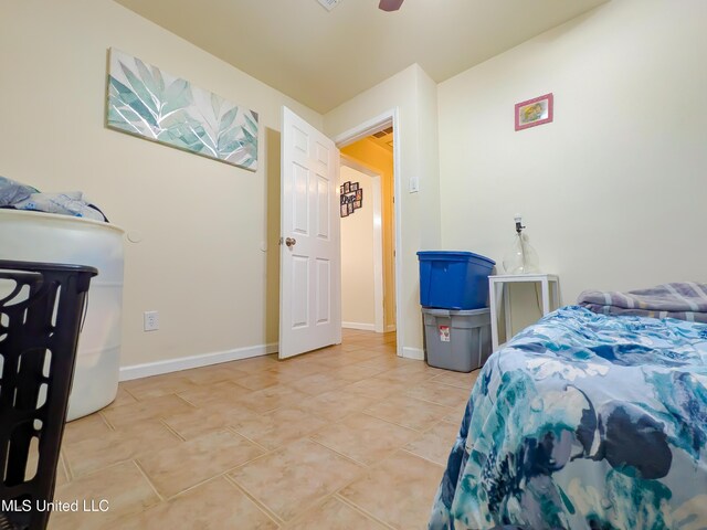2220 18th Ave, Gulfport, MS 39501 - bedroom featuring baseboards, ceiling fan, and light tile patterned flooring