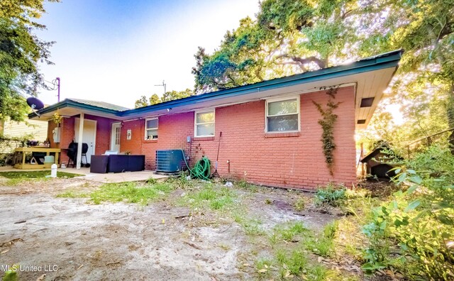 2220 18th Ave, Gulfport, MS 39501 - back of house with cooling unit and brick siding
