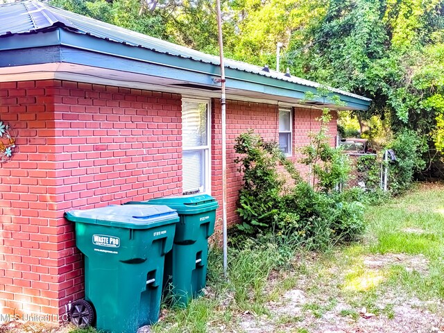 2220 18th Ave, Gulfport, MS 39501 - view of side of property with metal roof and brick siding