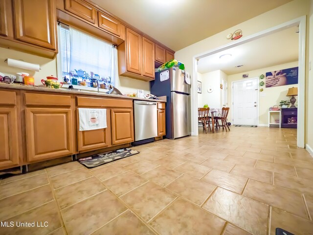 2220 18th Ave, Gulfport, MS 39501 - kitchen featuring light countertops, brown cabinetry, and stainless steel appliances
