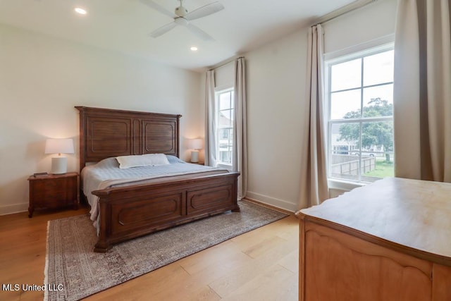 405 Mason Ave, Long Beach, MS 39560 - bedroom with multiple windows, light wood finished floors, recessed lighting, and ceiling fan