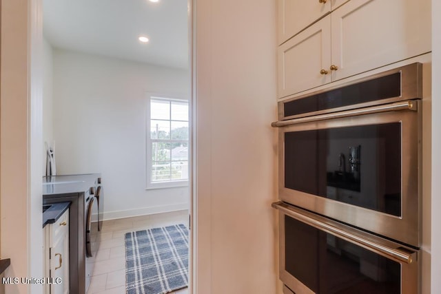 405 Mason Ave, Long Beach, MS 39560 - washroom with washing machine and clothes dryer, recessed lighting, and light tile patterned floors
