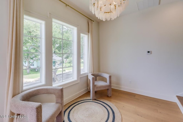 405 Mason Ave, Long Beach, MS 39560 - living area with healthy amount of natural light, a chandelier, and wood finished floors