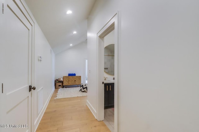 405 Mason Ave, Long Beach, MS 39560 - hallway with vaulted ceiling, light wood-style flooring, and recessed lighting