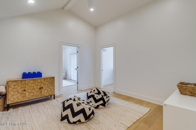 405 Mason Ave, Long Beach, MS 39560 - living area with beamed ceiling, wood finished floors, and high vaulted ceiling