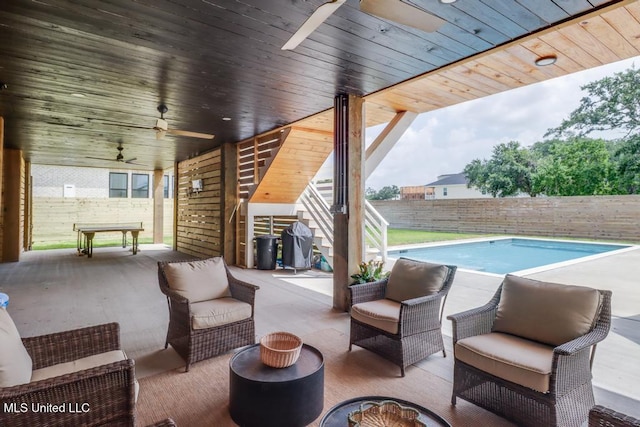 405 Mason Ave, Long Beach, MS 39560 - fenced backyard featuring a ceiling fan, outdoor lounge area, and a patio