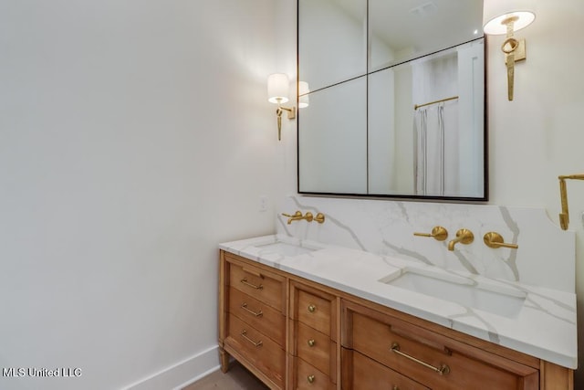 405 Mason Ave, Long Beach, MS 39560 - bathroom featuring vanity and decorative backsplash