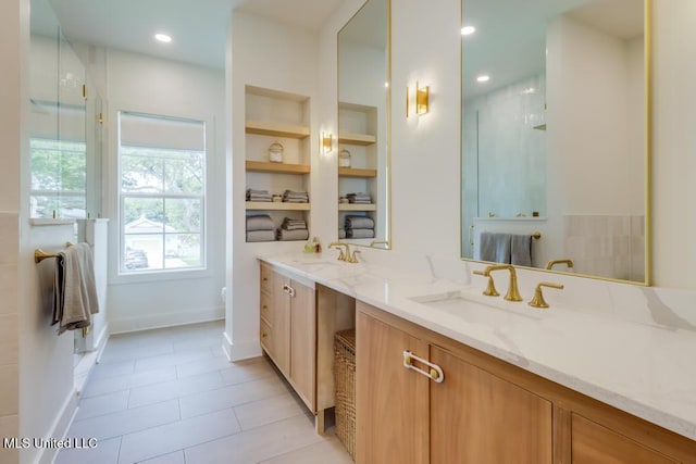405 Mason Ave, Long Beach, MS 39560 - full bath with double vanity, tile patterned flooring, and built in features