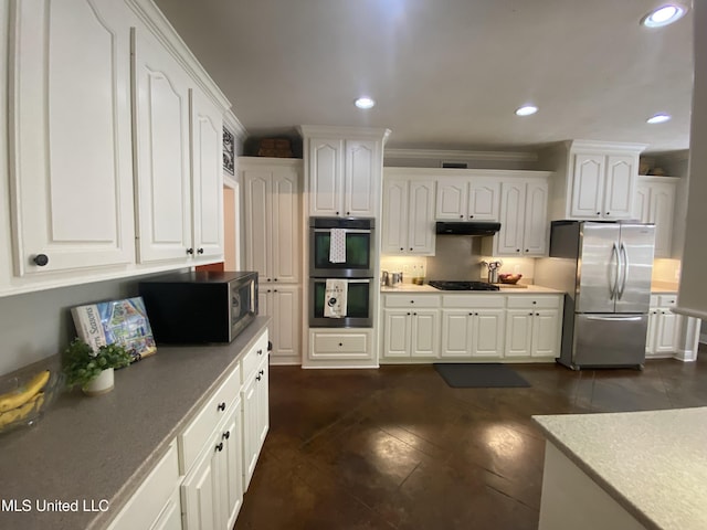 kitchen featuring appliances with stainless steel finishes, recessed lighting, white cabinetry, and under cabinet range hood