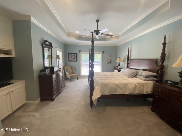 bedroom with baseboards, ornamental molding, a tray ceiling, recessed lighting, and light carpet