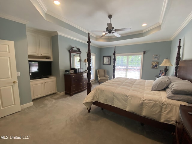 bedroom featuring a tray ceiling, light carpet, ornamental molding, and recessed lighting