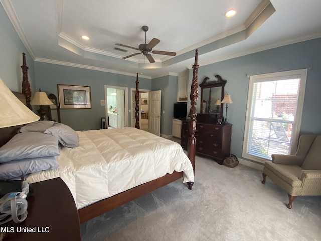 bedroom featuring ornamental molding, light carpet, recessed lighting, visible vents, and a tray ceiling