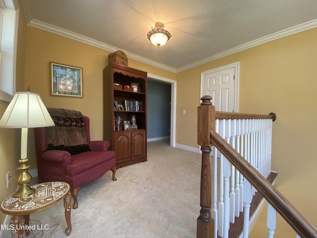 living area featuring ornamental molding, baseboards, an upstairs landing, and light carpet