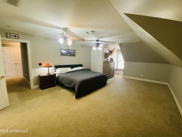 bedroom featuring visible vents, baseboards, and light carpet