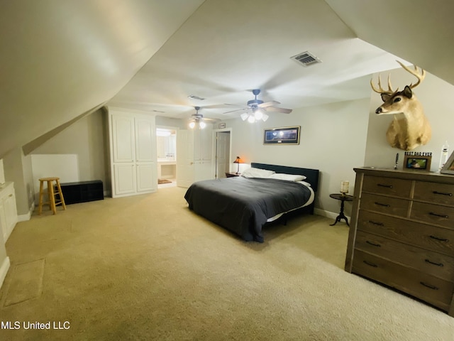 bedroom with visible vents, baseboards, a closet, and light carpet
