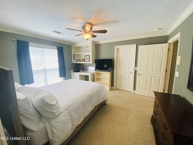 bedroom with ornamental molding, visible vents, a ceiling fan, and light colored carpet